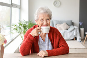 woman drinking her tea learning about clover hill senior living