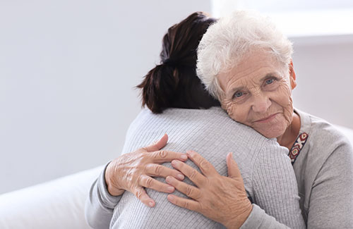 a woman hugs her daughter as she they think about clover hill