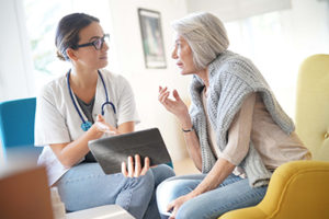 doctor helping a woman with her medication managment