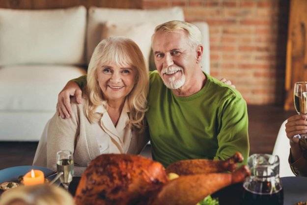 an older couple celebrates thanksgiving in senior living